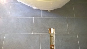 Replacement tile grouted